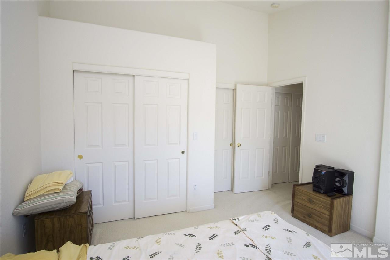 9428 Mammoth Drive Reno, NV 89521 - Photo 7 of 18 a bedroom with a bed and a couch