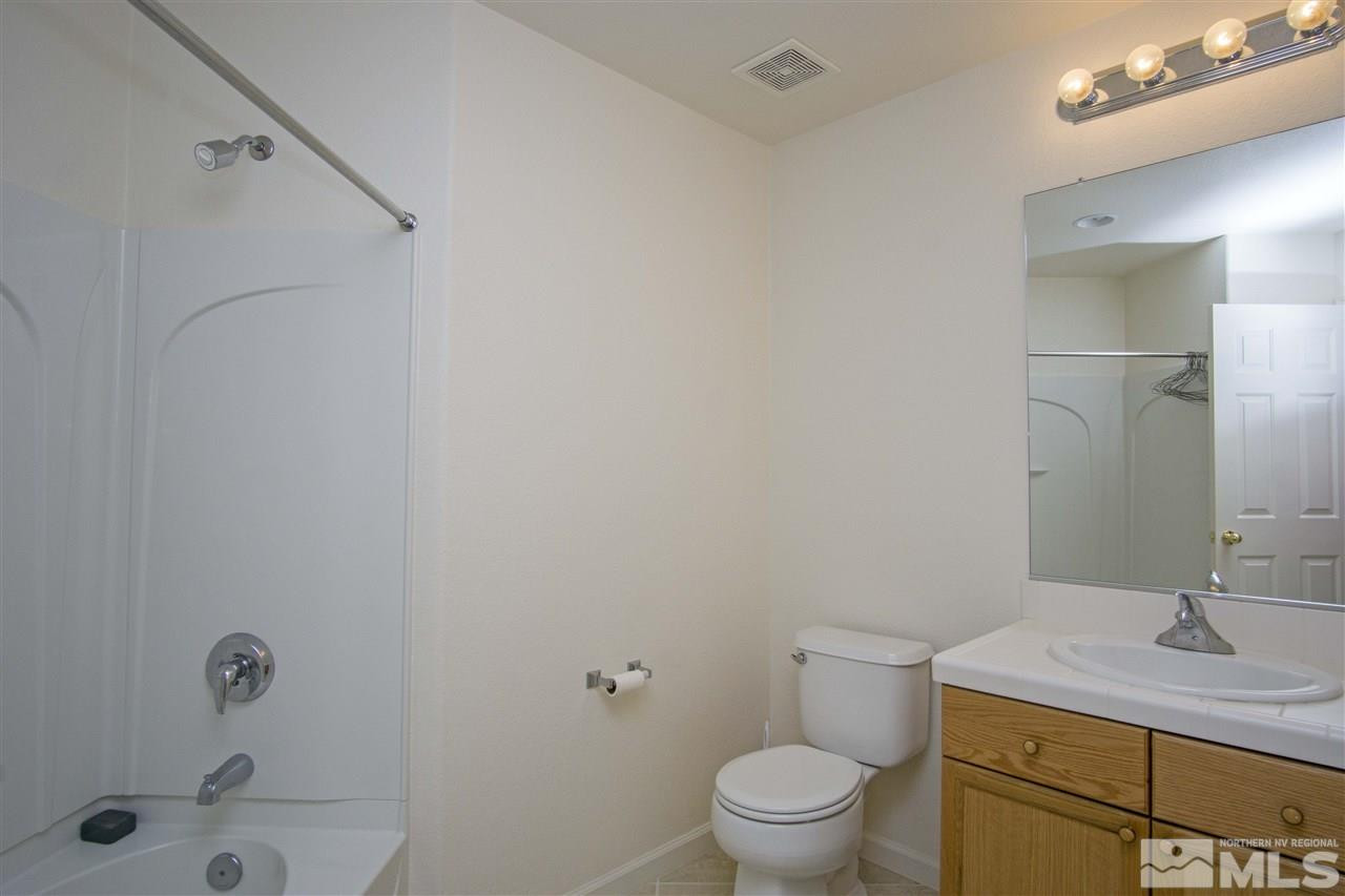 9428 Mammoth Drive Reno, NV 89521 - Photo 8 of 18 a bathroom with a sink and a toilet