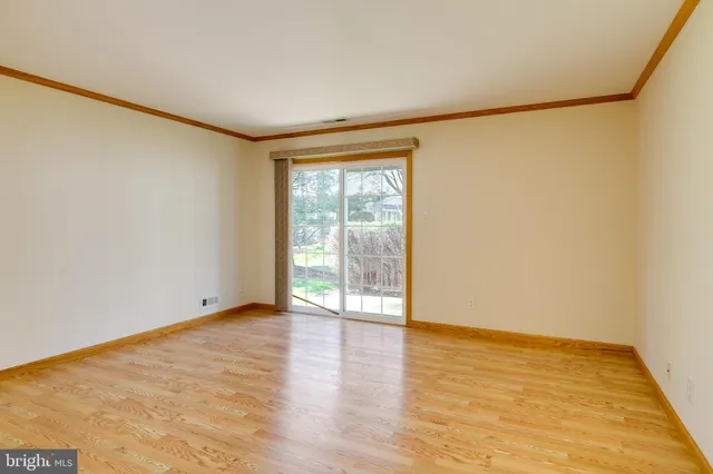 a view of a kitchen with a sink and a refrigerator