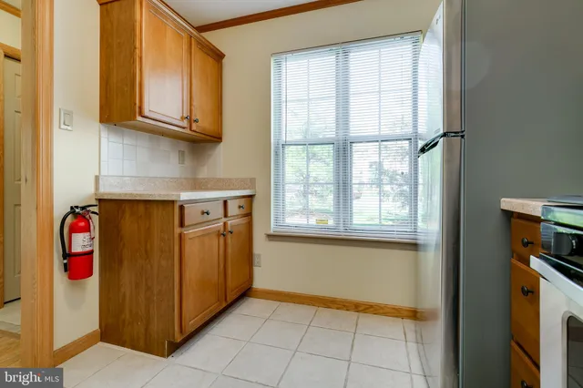 a view of a kitchen with electric appliances