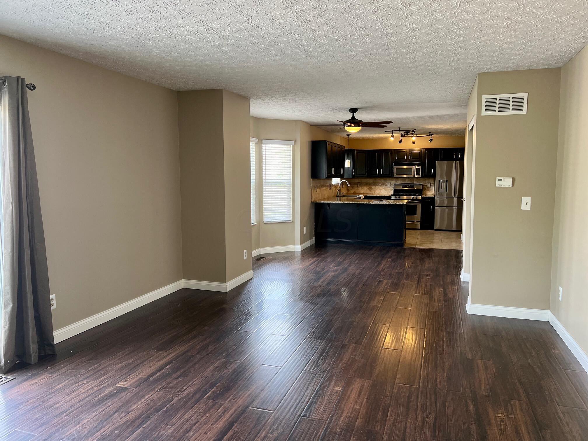 142 Harvard Loop Delaware, OH 43015 - Photo 12 of 37 Family Room into Kitchen