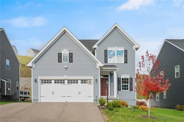 a view of garage and yard