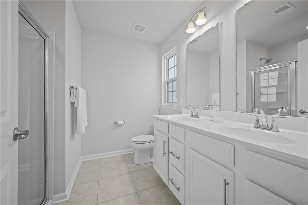 440 Sarjean Way Zelienople, PA 16063 - Photo 23 of 50 The primary bathroom features a double vanity and large shower.