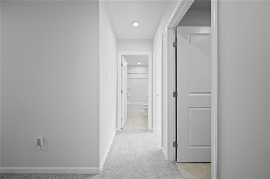 440 Sarjean Way Zelienople, PA 16063 - Photo 27 of 50 Upper level hall with the laundry room to the right.