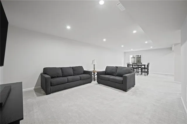 a living room with furniture and a couch