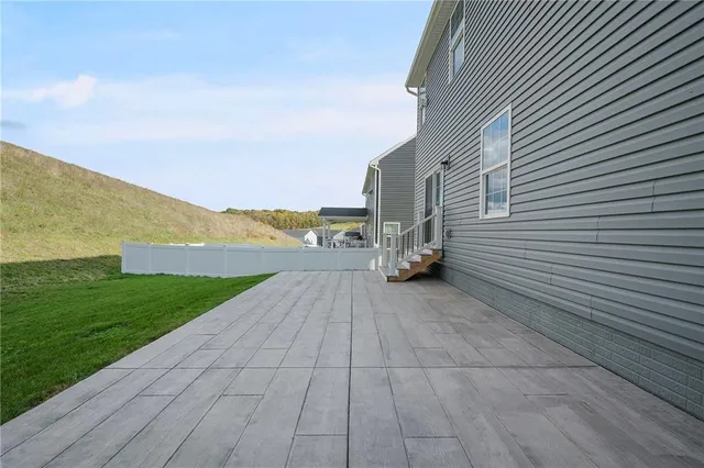 a view of an ocean with beach and mountain in the back