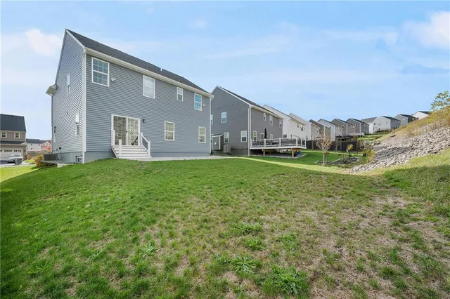 a view of a field with an ocean