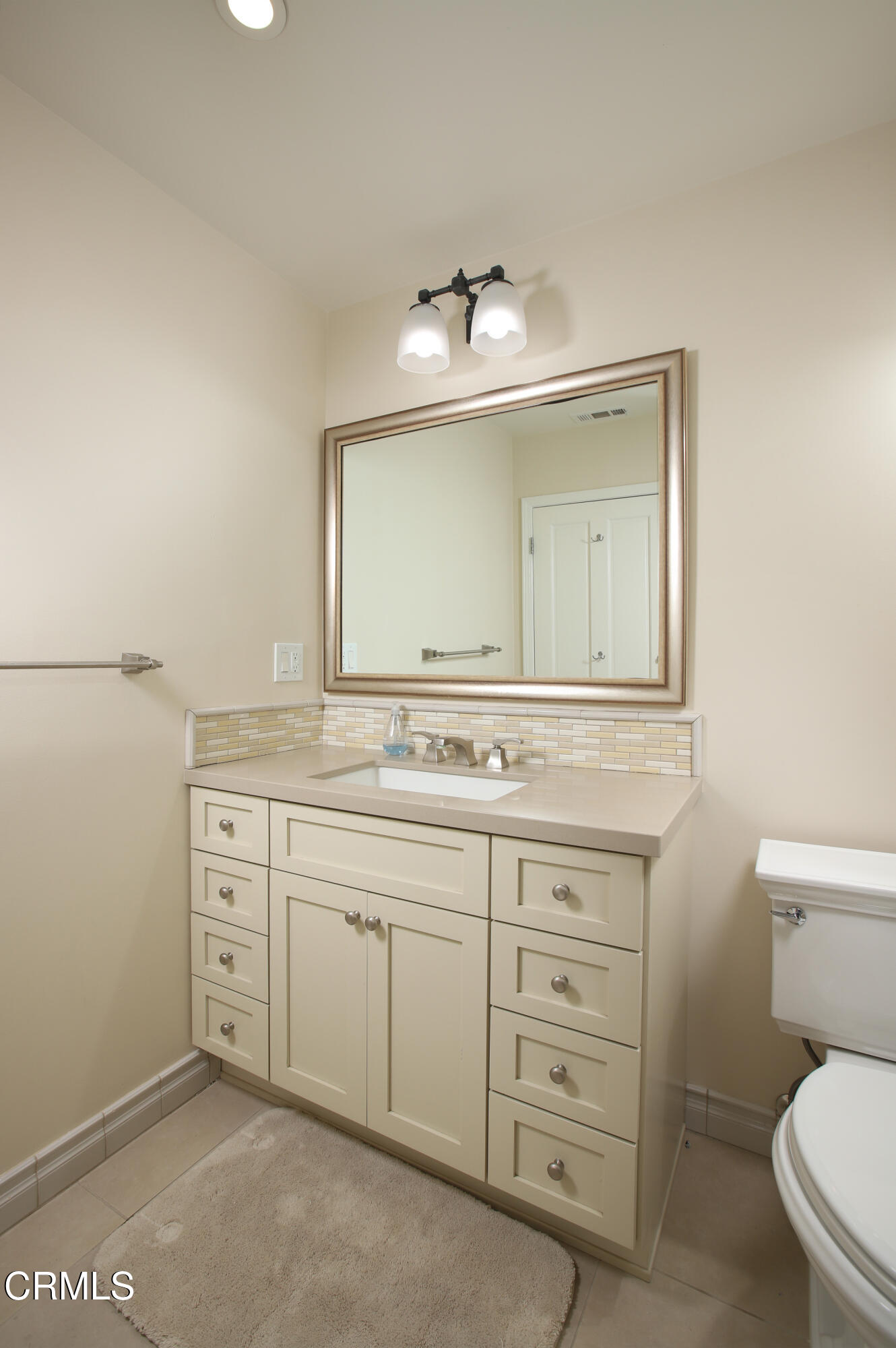 181 Sierra View Road Pasadena, CA 91105 - Photo 26 of 41 a bathroom with a toilet sink and mirror