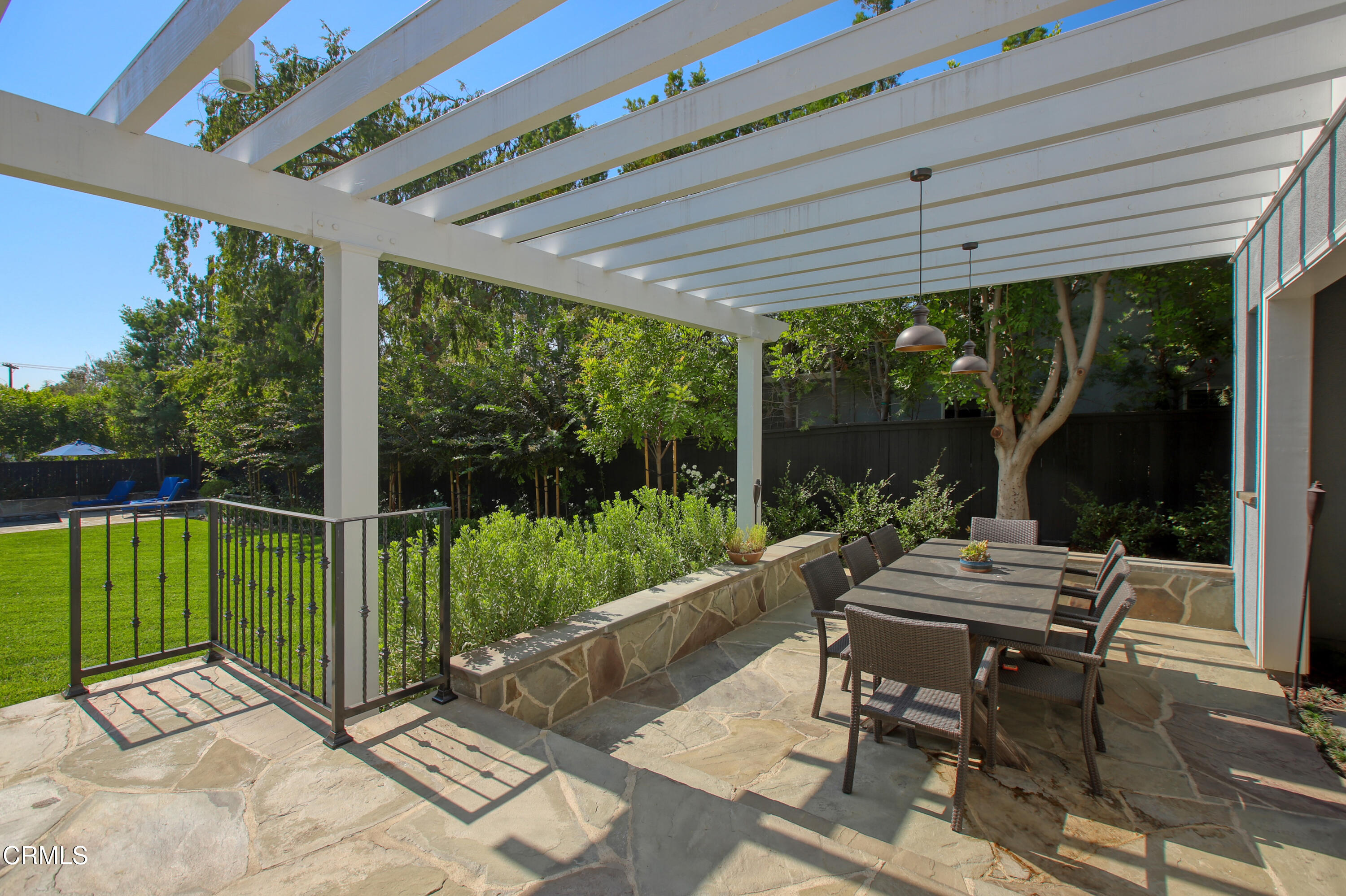 181 Sierra View Road Pasadena, CA 91105 - Photo 33 of 41 a view of a patio with a table chairs and a backyard