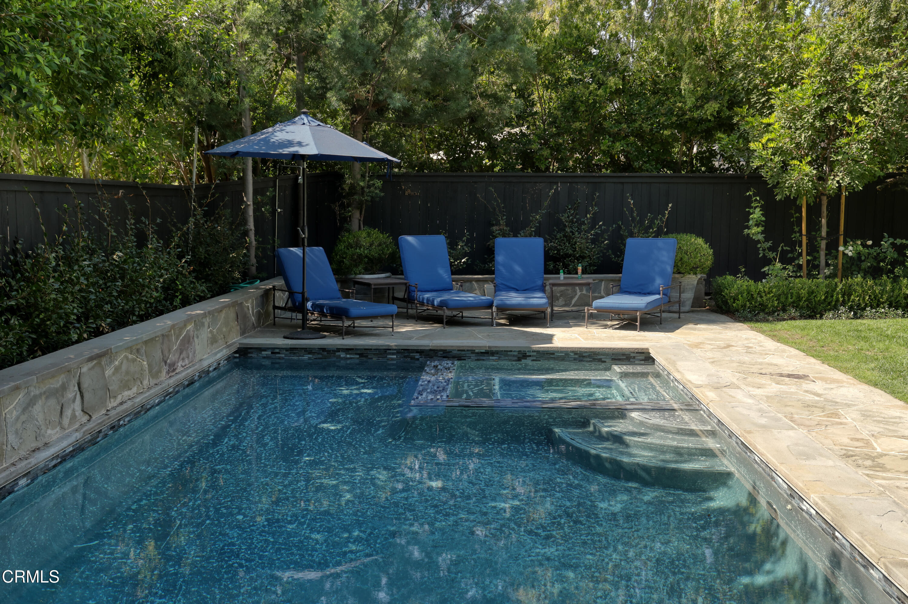 181 Sierra View Road Pasadena, CA 91105 - Photo 38 of 41 a view of a table and chairs under an umbrella in backyard
