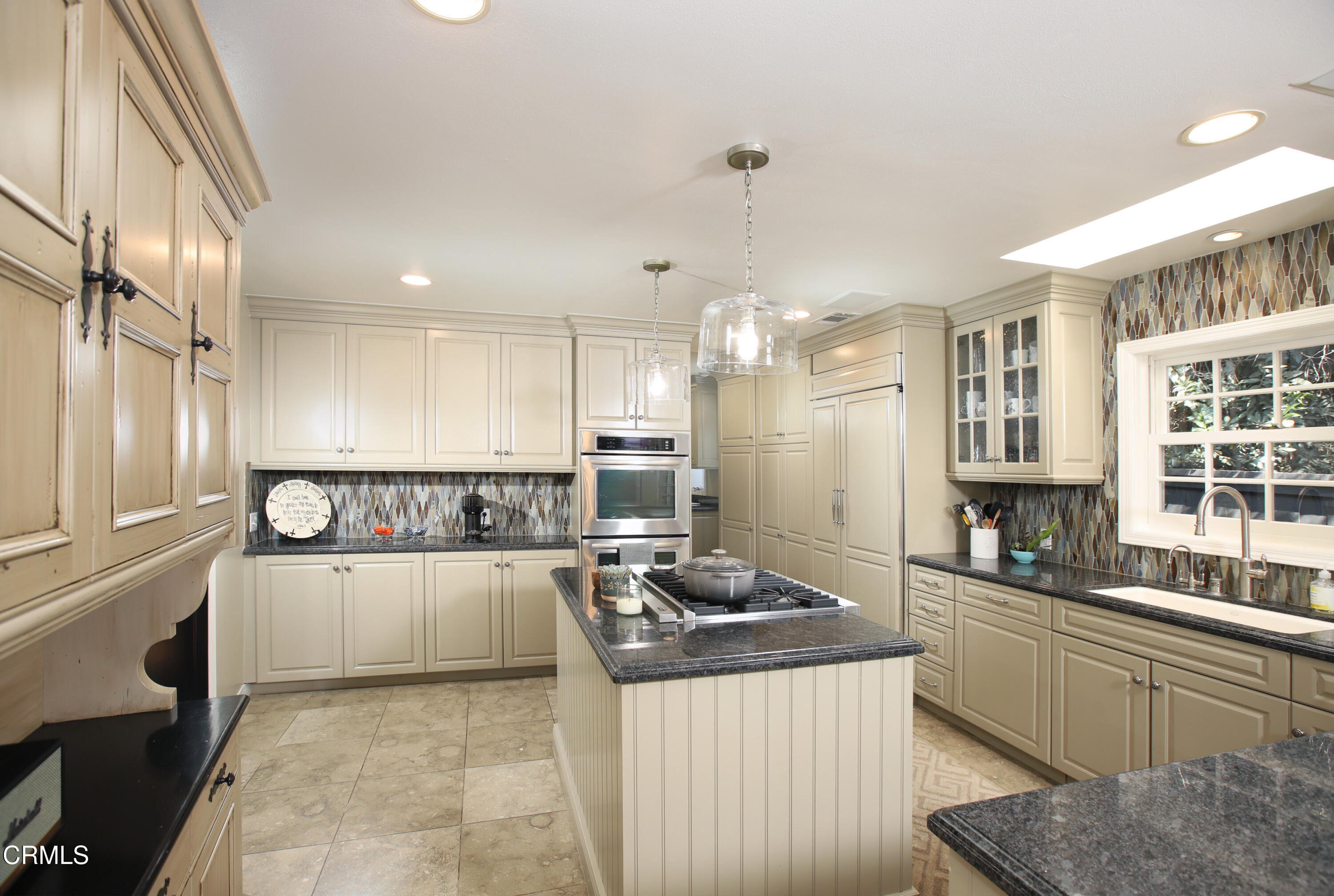 181 Sierra View Road Pasadena, CA 91105 - Photo 9 of 41 a kitchen with stainless steel appliances granite countertop a stove and a refrigerator