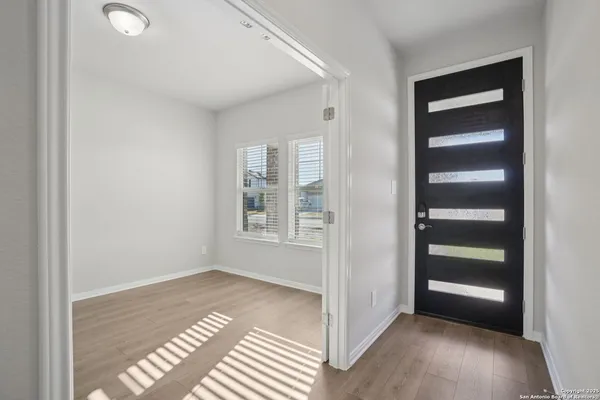 a view of an empty room with a window