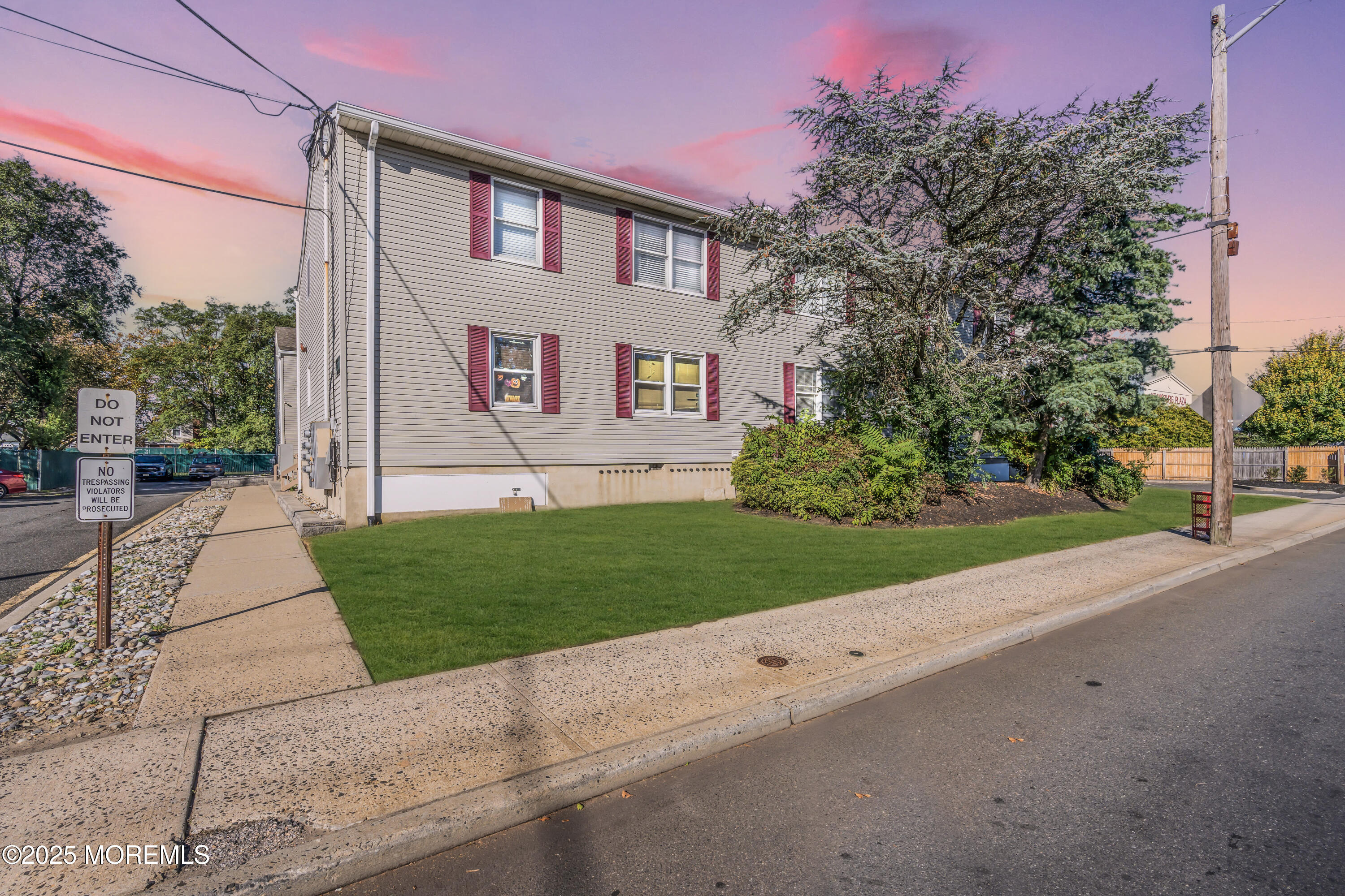 213 Main Street, Unit 17 Keansburg, NJ 07734 - Photo 1 of 15 a front view of a house with a yard and garage