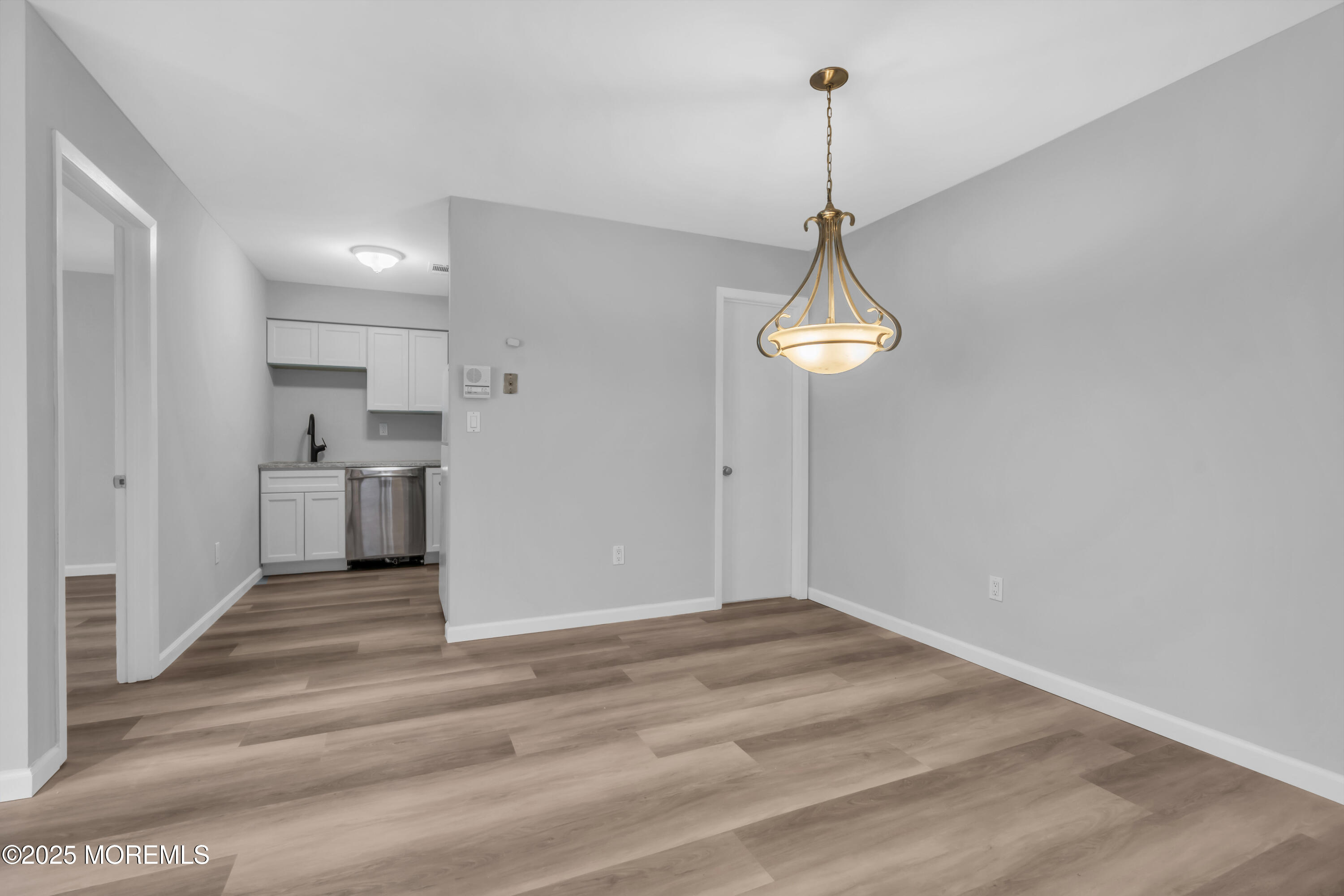 213 Main Street, Unit 17 Keansburg, NJ 07734 - Photo 11 of 15 a view of a room with cabinet and wooden floor