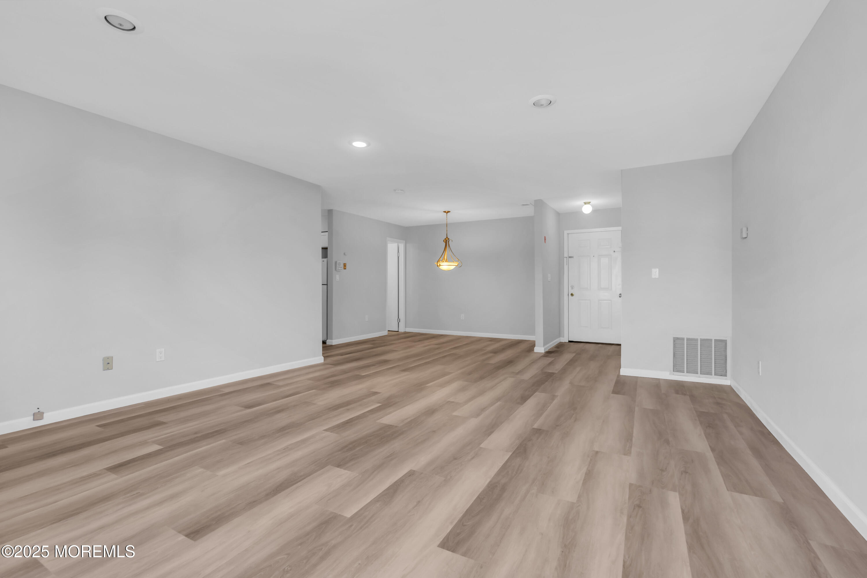 213 Main Street, Unit 17 Keansburg, NJ 07734 - Photo 6 of 15 a view of empty room with wooden floor