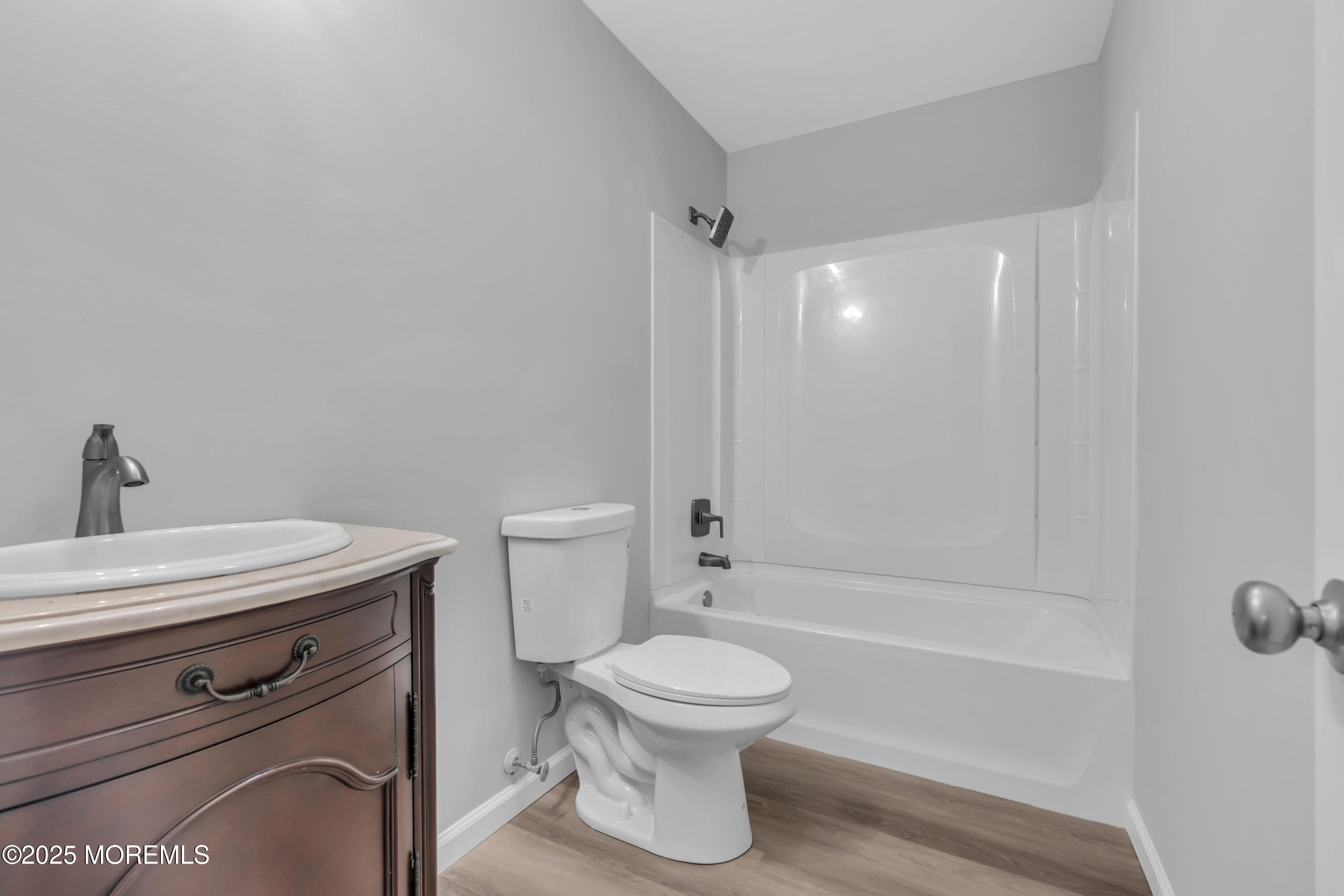 213 Main Street, Unit 17 Keansburg, NJ 07734 - Photo 10 of 15 a bathroom with a toilet a sink and bathtub