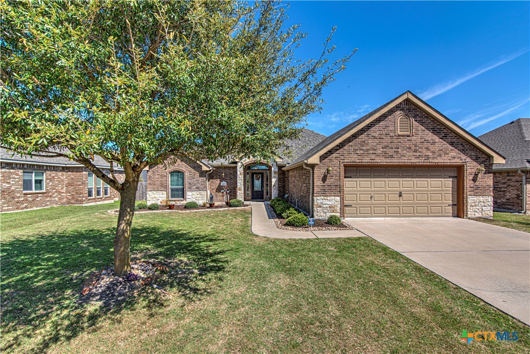 412 Dandridge Drive Temple, TX 76502 - Photo 1 of 44 a front view of a house with a yard and garage