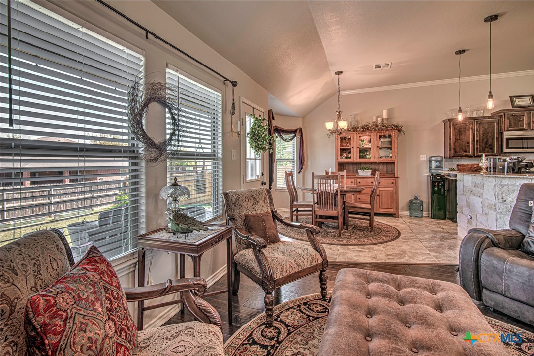 412 Dandridge Drive Temple, TX 76502 - Photo 12 of 44 a living room with furniture and a chandelier