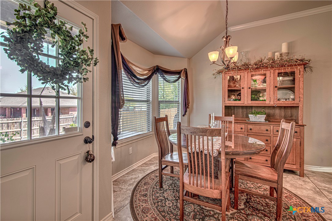 412 Dandridge Drive Temple, TX 76502 - Photo 13 of 44 a view of a dining room with furniture window and outside view