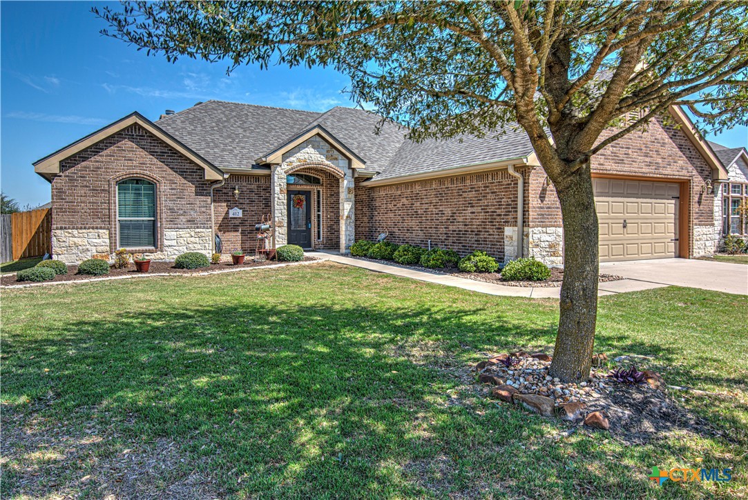 412 Dandridge Drive Temple, TX 76502 - Photo 2 of 44 a front view of a house with yard and green space