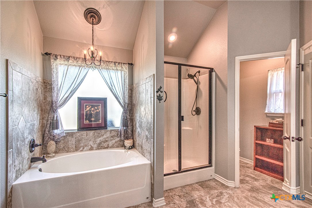 412 Dandridge Drive Temple, TX 76502 - Photo 24 of 44 a bathroom with a bathtub and a shower