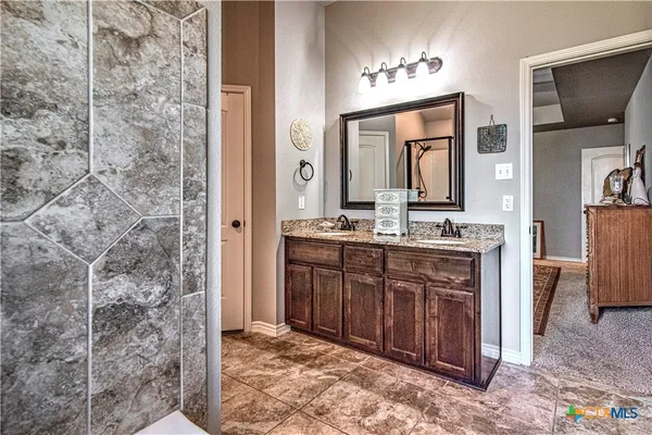 a bathroom with a sink and a mirror