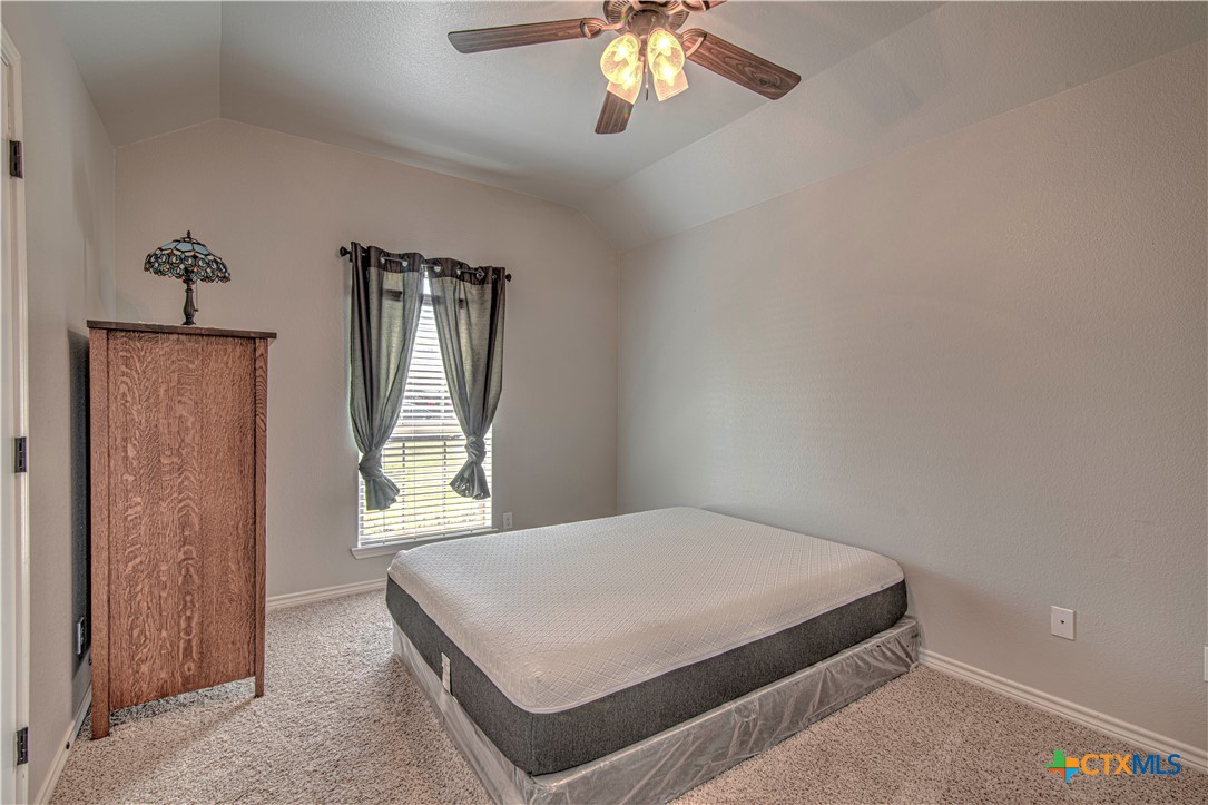 412 Dandridge Drive Temple, TX 76502 - Photo 28 of 44 a bedroom with a bed and a window