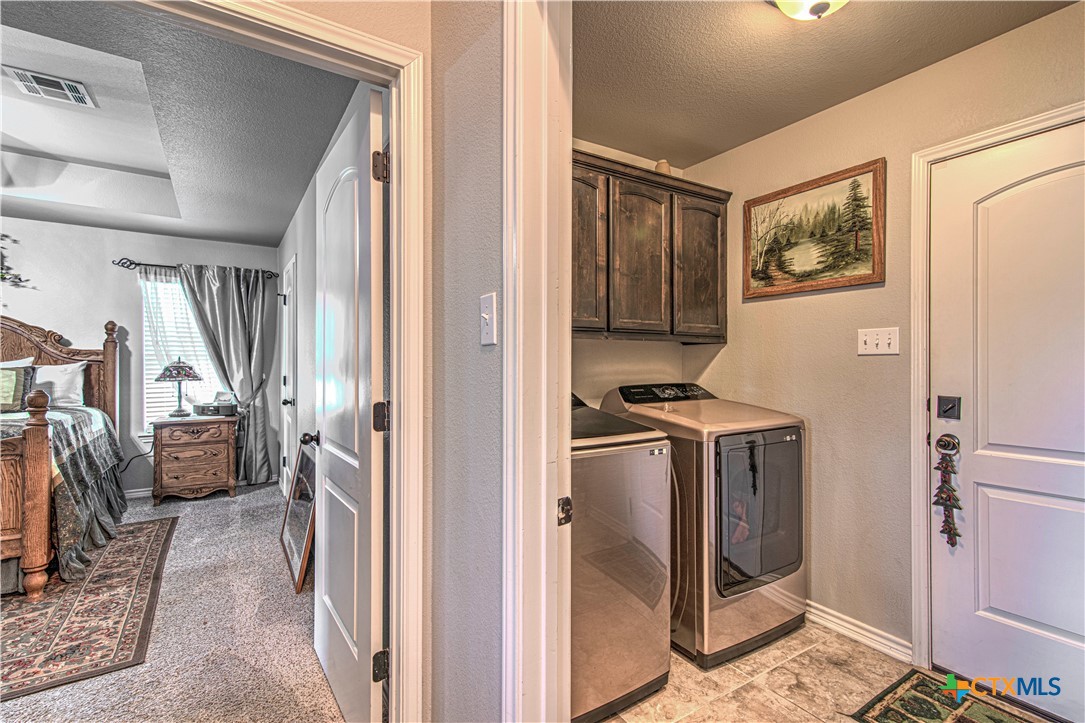 412 Dandridge Drive Temple, TX 76502 - Photo 31 of 44 a view of a kitchen with fridge and wooden floor