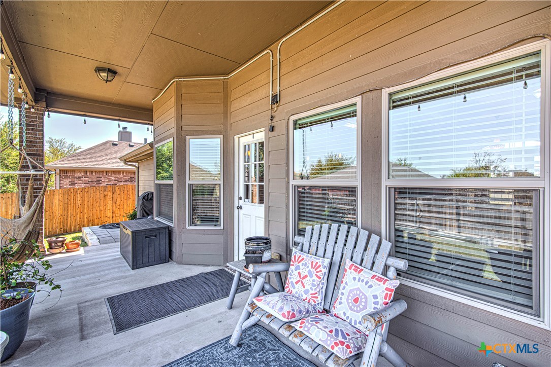 412 Dandridge Drive Temple, TX 76502 - Photo 32 of 44 a balcony with furniture and a potted plant