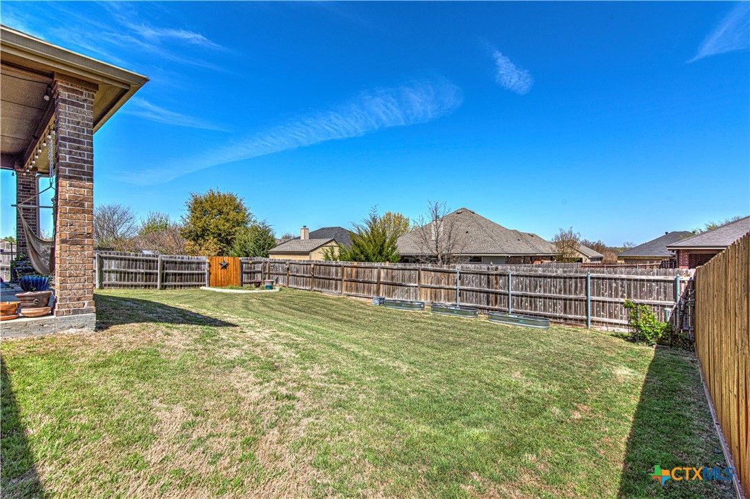 412 Dandridge Drive Temple, TX 76502 - Photo 34 of 44 a view of a backyard with plants