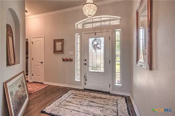 a view of entryway with wooden floor