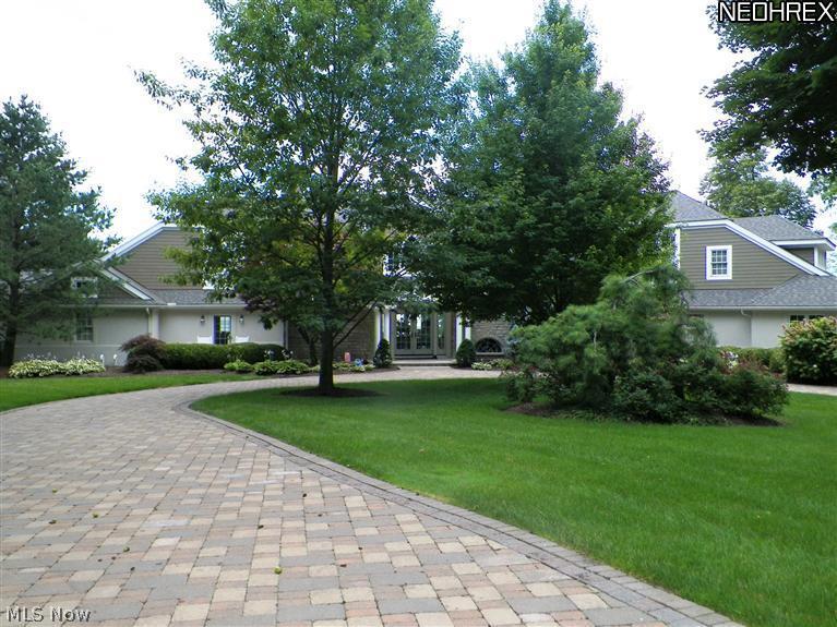 2730 North Bluff Ridge Drive Port Clinton, OH 43452 - Photo 3 of 25 The circular paved drive leads into the court yard entrance from the road.