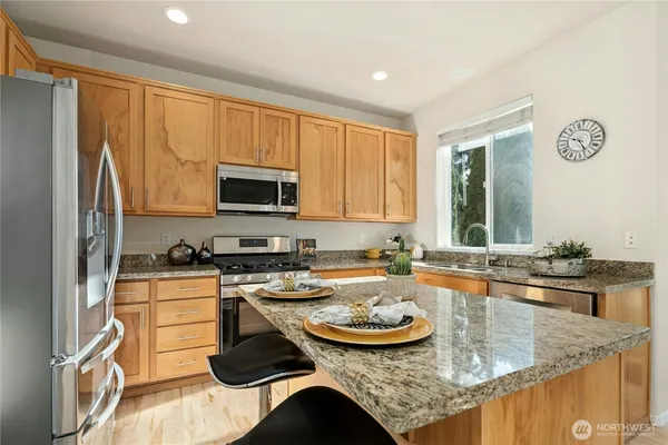a kitchen with a stove and a sink