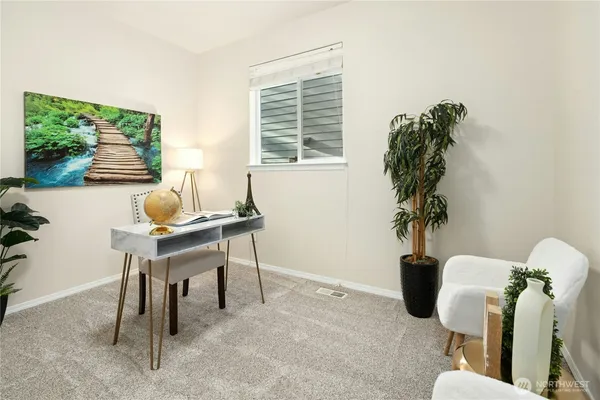 a workspace with furniture and a window