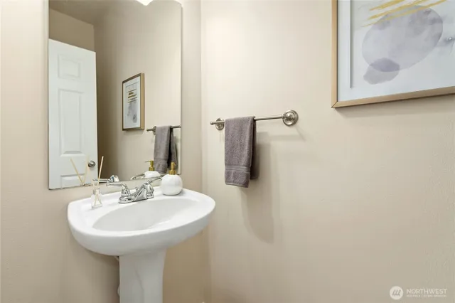 a bathroom with a sink and mirror