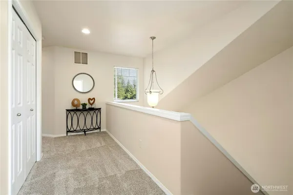 a view of a room with window and furniture
