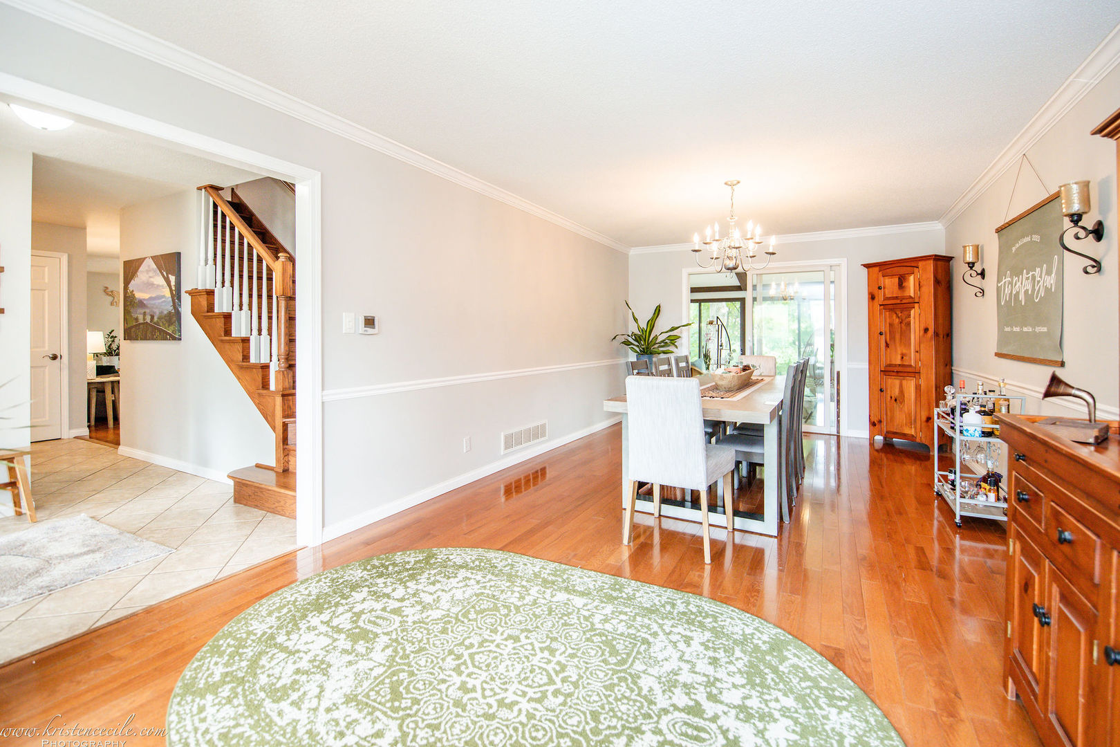 5 Inverness Drive Bourbonnais, IL 60914 - Photo 14 of 90 a living room with fireplace furniture and a dining table with wooden floor