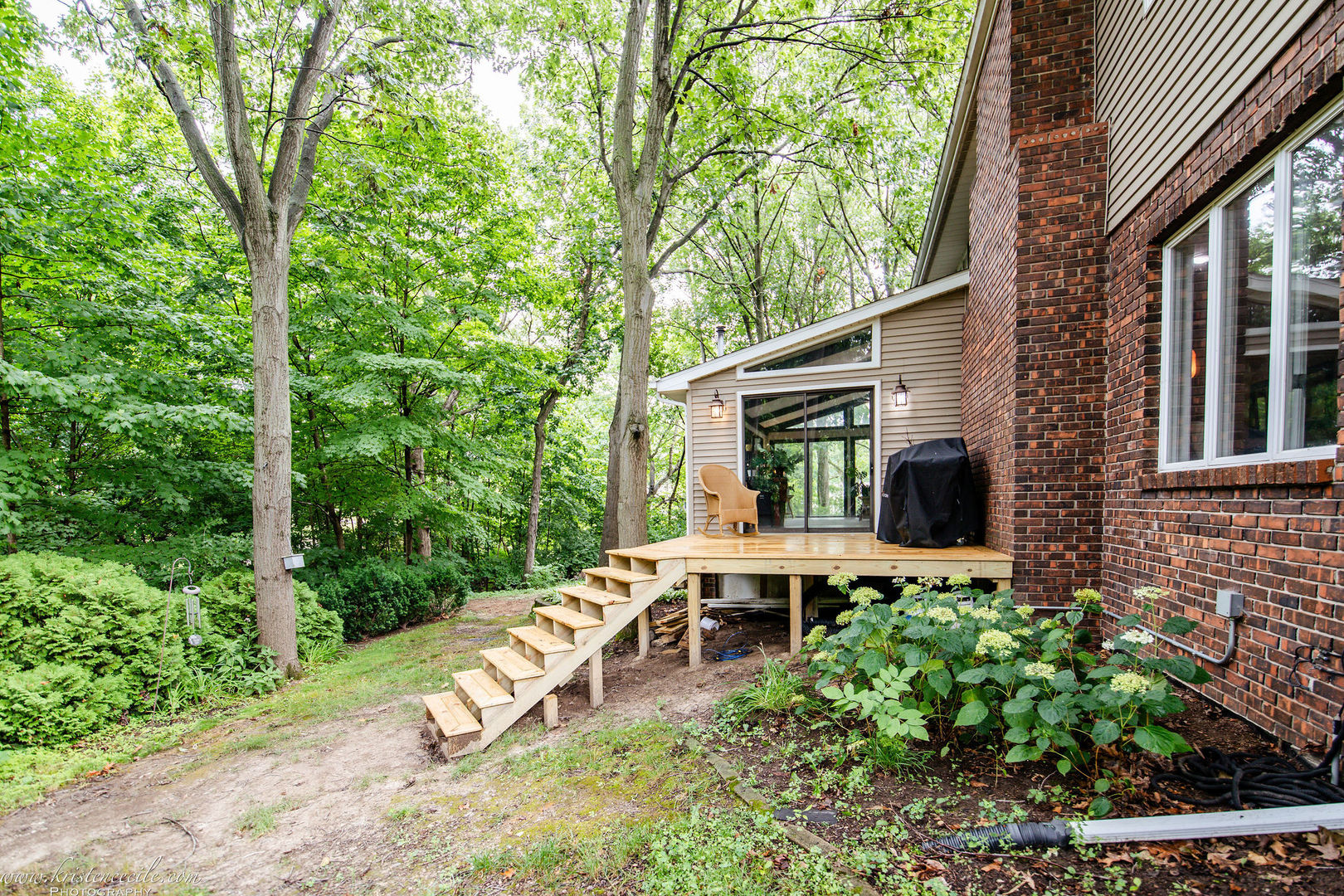 5 Inverness Drive Bourbonnais, IL 60914 - Photo 75 of 90 a view of a patio with table and chairs potted plants and large tree