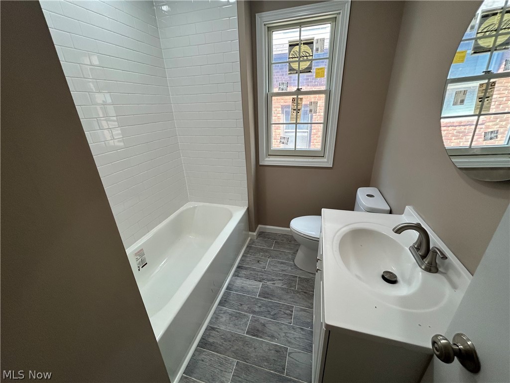 13537 Cedar Road Cleveland, OH 44118 - Photo 15 of 30 Full bathroom with a healthy amount of sunlight, toilet, oversized vanity, and tile floors