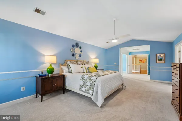 a very nice looking room with a large window and chandelier