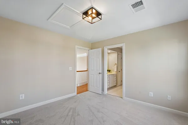 an empty room with a empty space and a ceiling fan