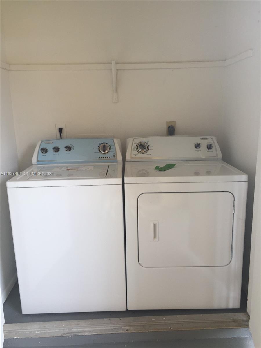 10441 Southwest 156th Court, Unit 421 Miami, FL 33196 - Photo 15 of 36 a utility room with dryer and washer