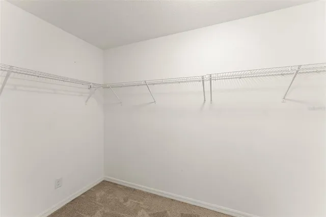 a view of a hallway with windows