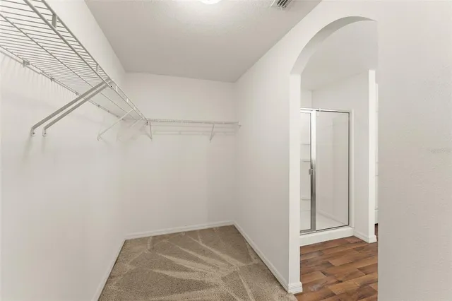 a view of a balcony with floor to ceiling windows