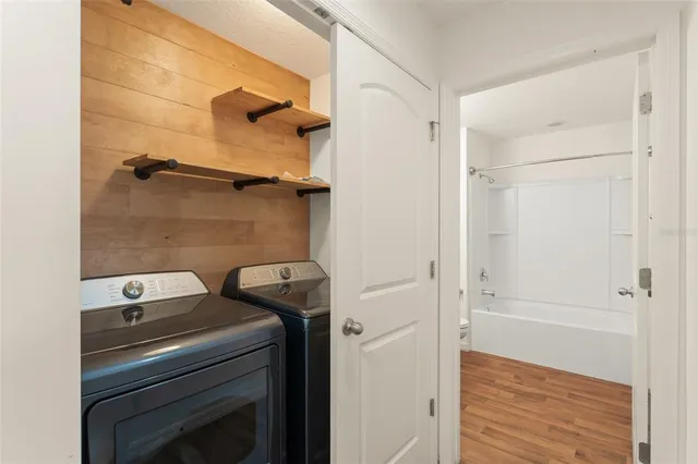 a view of bathroom with washer and dryer