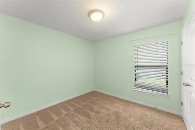 a view of a room that has a window in it