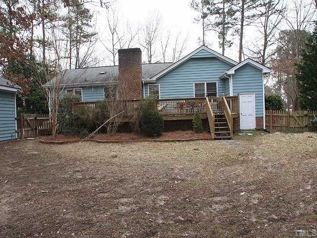 7517 Old Hundred Road Raleigh, NC 27613 - Photo 12 of 12 a view of a house with backyard and trees