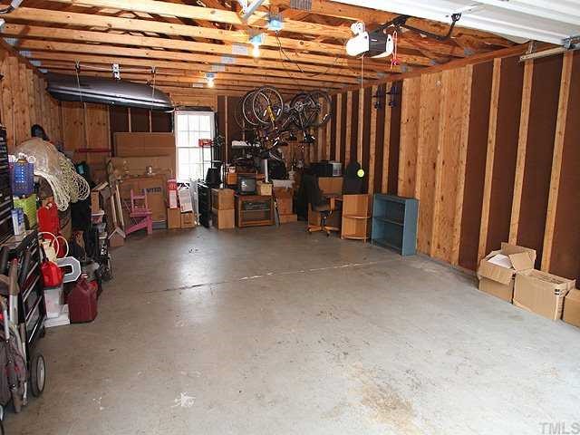 7517 Old Hundred Road Raleigh, NC 27613 - Photo 9 of 12 a view of a storage room with furniture and a window