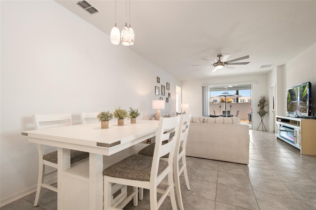1172 Tyler Loop Lake Wales, FL 33859 - Photo 15 of 56 a view of a dining room with furniture and wooden floor