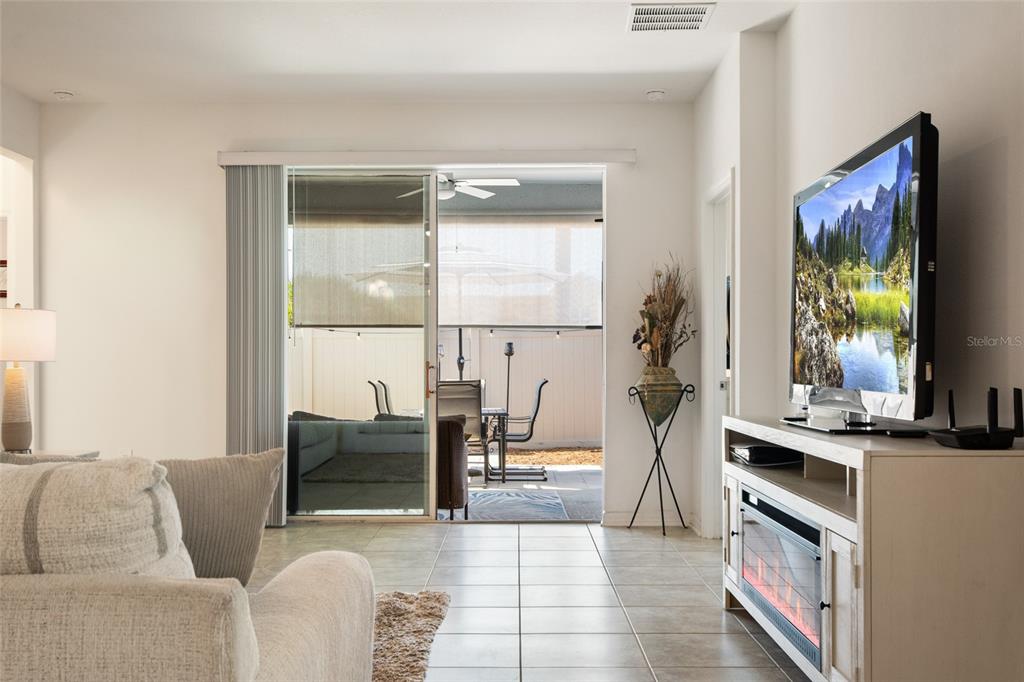 1172 Tyler Loop Lake Wales, FL 33859 - Photo 21 of 56 a living room with furniture and a flat screen tv